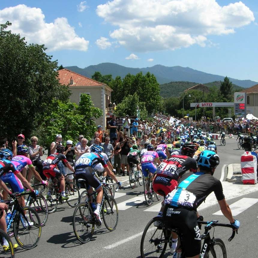 Tour de France 2013 peloton racing through a Corsican village